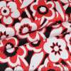 Жаккард стрейч чорний в червоно-білі квіти ш.130